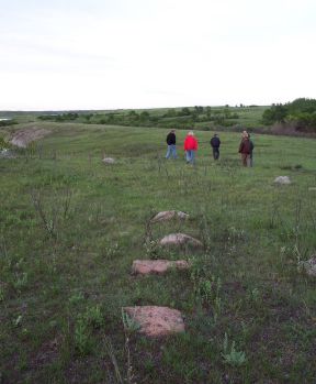 Photo: A party of volunteers ends the day after walking a section of land along the Chain Lakes.
